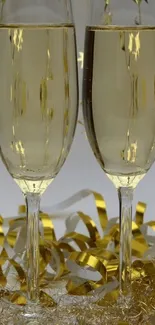 Mobile wallpaper featuring champagne glasses with gold ribbons.