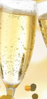 Champagne glasses with golden bubbles in elegant wallpaper.