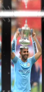 Athlete celebrating with a trophy in sky blue sports attire.