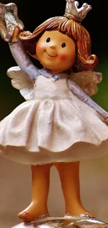 Charming angel figurine with star mobile wallpaper.