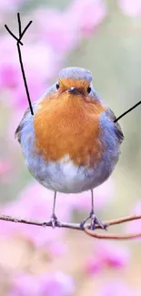 Charming bird perched on a pink blossom branch.