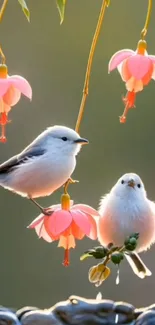 Two birds amongst pink fuchsia flowers.