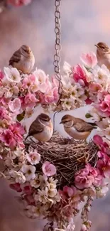 Heart-shaped floral arrangement with birds nestled.