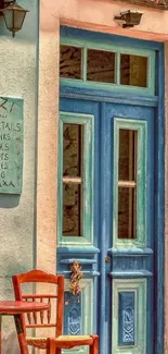 Charming blue door at a Greek café with rustic details.