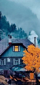 Charming cabin nestled in autumn mist with vibrant yellow tree in forest setting.