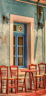 Quaint outdoor cafe with chairs and a blue window frame.