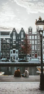 Charming canal cityscape with Amsterdam architecture and reflective water in autumn.