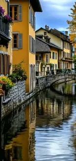 A charming canal townscape with colorful buildings and a stone bridge.