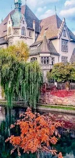 Castle by a river with lush greenery and serene surroundings.