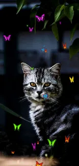 Cat with golden eyes in a dark garden setting, surrounded by green leaves.