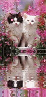 Two cute kittens among pink flowers with water reflection.