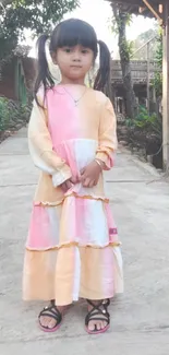 Charming young girl on a serene nature walk with pastel dress.