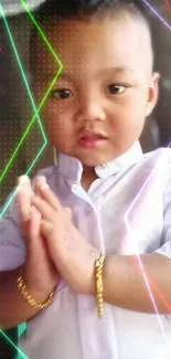 A charming child in a white shirt with a thoughtful expression against a wooden background.