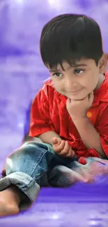 Charming child in red shirt on a purple background mobile wallpaper.