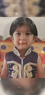 Portrait of a child in traditional attire with a warm beige background.