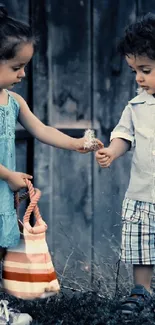 Two children holding hands in a charming outdoor scene with dark blue background.