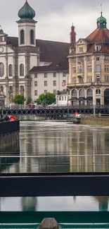 Charming cityscape with river reflections and historic architecture.