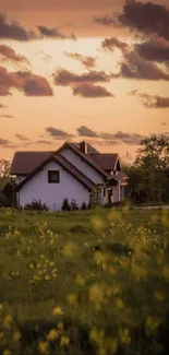 Country farmhouse at sunset with lush green fields and a colorful sky.