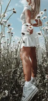 Woman in white dress in daisy field.