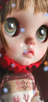 Doll with green eyes wearing red scarf and sweater with snowflakes.