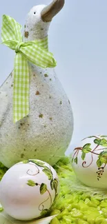 Ceramic duck with decorated Easter eggs on green surface.