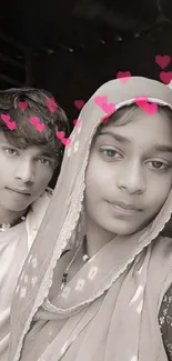 Young couple with heart filter and charming expressions.