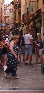 Charming European street with people and colorful buildings.