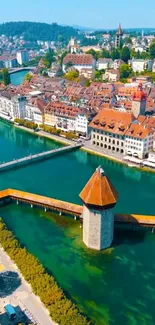 Aerial view of a European town with a river and classic architecture.
