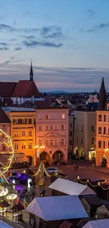 Charming cityscape at twilight with illuminated ferris wheel.