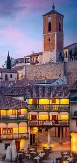 Scenic town with clock tower and plaza in evening light.