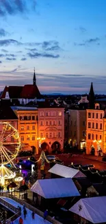 Charming evening townscape with Ferris wheel and illuminated buildings.