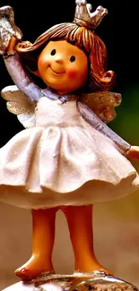 Charming fairy figurine with golden wings and crown.