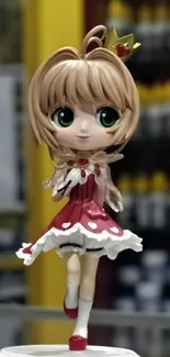 Charming anime figurine with heart dress and crown on a pedestal.