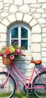 Pink bicycle with floral basket against a stone wall.