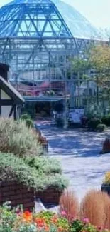 Charming garden with vibrant flowers and a glass pavilion.