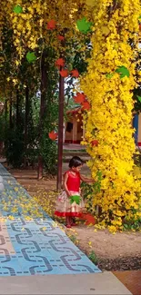 Child in garden with yellow flowers and teddy bear.