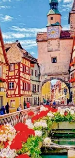 Medieval street with colorful buildings and a clock tower.