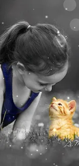 Young girl and kitten in a black and white image with orange kitten accent.