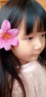 Girl with pink flower in her hair, soft colors.