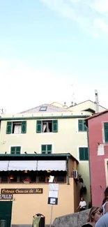 Italian street view with pastel buildings and a tranquil sky.