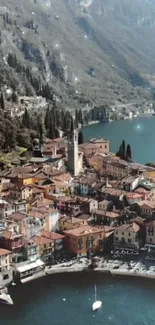 Aerial view of a quaint lakeside village with terracotta rooftops.