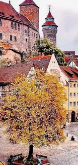 Town square with autumn tree and historic buildings.