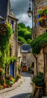 Charming medieval village street with stone buildings and greenery.