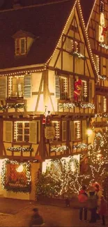 Medieval village at night with glowing lights and people in motion.