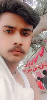 Young man with festive outdoor background.