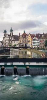 Riverside cityscape with historic buildings and serene river.