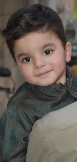 Smiling child in traditional outfit, close-up portrait.