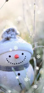 Charming snowman with frosty grass in a serene winter scene.