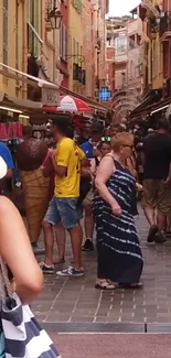 Crowded street market in European town with colorful shops and people.