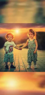 Two children holding hands under a vibrant sunset, creating a joyful and warm scene.